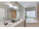 Bright main bathroom with double vanity, soaking tub, and separate shower at 3072 Parks Run, Loganville, GA 30052