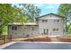 View of the backyard featuring a light grey home exterior, pool, and patio set at 4262 Hambrick Way, Stone Mountain, GA 30083