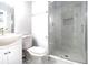 Bathroom with glass shower, toilet, and single sink vanity at 4262 Hambrick Way, Stone Mountain, GA 30083