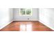 Bright bedroom with hardwood floors and ample natural light at 4262 Hambrick Way, Stone Mountain, GA 30083