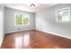 Bright bedroom with hardwood floors and windows offering natural light at 4262 Hambrick Way, Stone Mountain, GA 30083