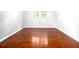 Bright bedroom featuring hardwood floors, natural light, and neutral walls at 4262 Hambrick Way, Stone Mountain, GA 30083