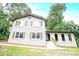 Angle view of painted brick home featuring arched entryways, and traditional windows at 4262 Hambrick Way, Stone Mountain, GA 30083