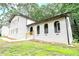 Side view of a painted-brick house with arched entryways and well-maintained landscaping at 4262 Hambrick Way, Stone Mountain, GA 30083