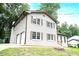 Charming two-story home with painted brick, traditional windows, and a lush green lawn at 4262 Hambrick Way, Stone Mountain, GA 30083