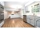 Updated kitchen offering quartz counters, modern appliances, and an open layout to the living space at 4262 Hambrick Way, Stone Mountain, GA 30083