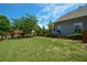 Well-maintained backyard with lush green lawn, complemented by charming wood fencing and landscaping at 4265 Pleasant Woods Dr, Cumming, GA 30028