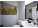 Chic half bathroom with a framed mirror, and a vessel sink at 4265 Pleasant Woods Dr, Cumming, GA 30028