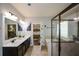 Elegant bathroom with double vanity, soaking tub, separate glass shower, and tile floors at 4265 Pleasant Woods Dr, Cumming, GA 30028
