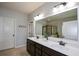 Elegant bathroom with a double vanity, large mirror, and a separate shower room at 4265 Pleasant Woods Dr, Cumming, GA 30028