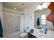 Cozy bathroom featuring a bathtub-shower combo, white tile, and dark-colored cabinets at 4265 Pleasant Woods Dr, Cumming, GA 30028
