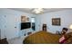 Comfortable bedroom with carpet flooring, ceiling fan, a television, and neutral wall paint at 4265 Pleasant Woods Dr, Cumming, GA 30028