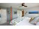 Bedroom featuring a ceiling fan and a large bed with a floral-patterned comforter at 4265 Pleasant Woods Dr, Cumming, GA 30028