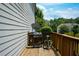 Wooden deck featuring a grill, satellite dish, and green tree-filled backyard at 4265 Pleasant Woods Dr, Cumming, GA 30028