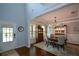 Bright dining room with hardwood floors, tall ceilings, and elegant trim at 4265 Pleasant Woods Dr, Cumming, GA 30028