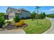 Corner lot featuring manicured lawn, fresh landscaping, and a beautiful home exterior at 4265 Pleasant Woods Dr, Cumming, GA 30028