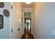 Hallway with hardwood floors and neutral paint that leads to the kitchen at 4265 Pleasant Woods Dr, Cumming, GA 30028