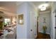 Hallway features decorative artwork and leads to a bright living room at 4265 Pleasant Woods Dr, Cumming, GA 30028