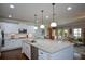 Spacious kitchen with granite countertops, stainless appliances and hardwood floors at 4265 Pleasant Woods Dr, Cumming, GA 30028
