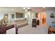 Spacious living room with a variety of comfortable seating options and ample natural light at 4265 Pleasant Woods Dr, Cumming, GA 30028