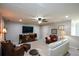 Comfortable living room with a ceiling fan, recessed lighting, and a large television at 4265 Pleasant Woods Dr, Cumming, GA 30028
