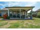 Open back patio with seating that offers an outdoor living space at 4265 Pleasant Woods Dr, Cumming, GA 30028