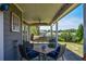 Inviting covered patio with comfortable seating, perfect for outdoor relaxation and entertaining guests at 4265 Pleasant Woods Dr, Cumming, GA 30028