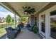 Back patio with chairs and a ceiling fan that offers an outdoor living space at 4265 Pleasant Woods Dr, Cumming, GA 30028