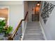 Carpeted staircase with decorative railing and ample lighting, complemented by stylish decor at 4265 Pleasant Woods Dr, Cumming, GA 30028