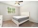 Simple bedroom with plush carpet and natural light through a window at 122 Riverbirch Way, Dallas, GA 30157