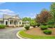 Elegant clubhouse with stone accents, covered entrance, and manicured landscaping for upscale community living at 122 Riverbirch Way, Dallas, GA 30157