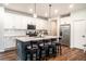 Stylish eat-in kitchen with stainless steel appliances, a large kitchen island, and ample cabinet space at 122 Riverbirch Way, Dallas, GA 30157