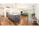 Open-concept kitchen and living area with hardwood floors, stainless steel appliances, and plenty of living space at 122 Riverbirch Way, Dallas, GA 30157