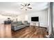 Comfortable living room with hardwood floors, plenty of seating, and an open floor plan into the kitchen at 122 Riverbirch Way, Dallas, GA 30157