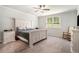 Cozy main bedroom featuring a ceiling fan, large bed, and carpeted floor at 122 Riverbirch Way, Dallas, GA 30157