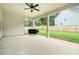 Covered patio featuring concrete floor and a grill overlooking a fenced yard, ideal for entertaining at 122 Riverbirch Way, Dallas, GA 30157