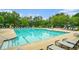 Community swimming pool with clear blue water, lounge chairs, and ample space for relaxation and recreation at 122 Riverbirch Way, Dallas, GA 30157
