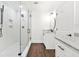 Bright bathroom featuring glass shower, marble countertops and dark wood floors at 2277 Peachtree Ne Rd # 405, Atlanta, GA 30309