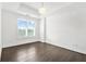 Bright bedroom featuring hardwood floors, white walls, recessed lighting, and a large window at 2277 Peachtree Ne Rd # 405, Atlanta, GA 30309