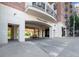 View of the Aramore building entrance with covered parking and upscale architectural details at 2277 Peachtree Ne Rd # 405, Atlanta, GA 30309