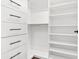Bright walk-in closet with custom shelving and drawer storage at 2277 Peachtree Ne Rd # 405, Atlanta, GA 30309