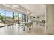 Bright common area with multiple tables and floor to ceiling windows at 2277 Peachtree Ne Rd # 405, Atlanta, GA 30309