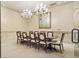 Formal dining room featuring an elegant chandelier and a large wooden table with seating for ten at 2277 Peachtree Ne Rd # 405, Atlanta, GA 30309