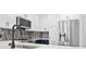 Bright kitchen with a gray tile backsplash, stainless steel fridge and white cabinets at 2277 Peachtree Ne Rd # 405, Atlanta, GA 30309