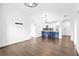 Open-concept living room with sleek wood floors and modern lighting fixtures at 2277 Peachtree Ne Rd # 405, Atlanta, GA 30309