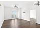 Bright living room featuring wood floors and modern lighting fixtures at 2277 Peachtree Ne Rd # 405, Atlanta, GA 30309