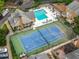 Aerial view showing a community pool, tennis court, clubhouse, and manicured landscaping at 50 Mount Vernon Cir, Atlanta, GA 30338