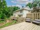 Backyard featuring a large, private deck and mature trees at 50 Mount Vernon Cir, Atlanta, GA 30338