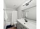 Bathroom with a large vanity, modern fixtures, and a shower-tub combination at 50 Mount Vernon Cir, Atlanta, GA 30338