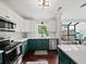 Bright kitchen with stainless steel appliances, two-tone cabinets, and white subway tile backsplash at 50 Mount Vernon Cir, Atlanta, GA 30338